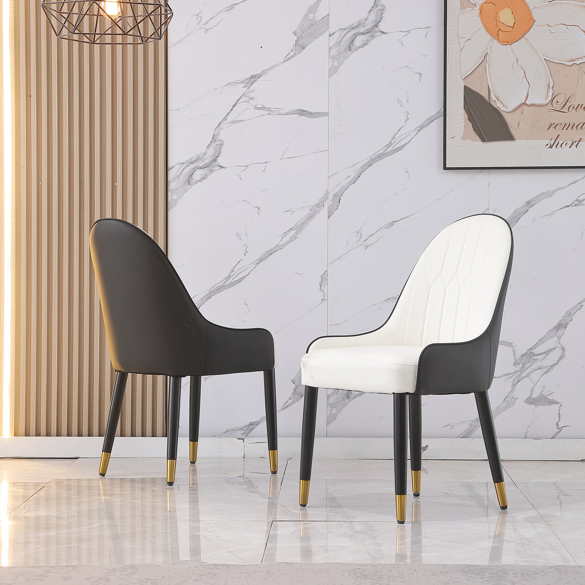 Modern black and white leather dining chair with gold accents