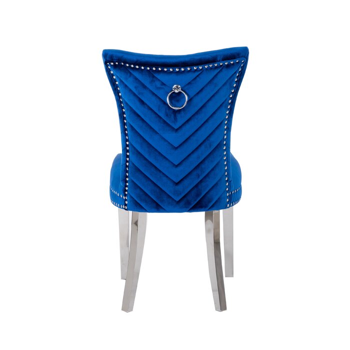 Royal blue velvet dining chair with chevron stitching and silver ring pull