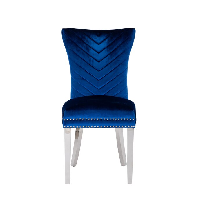 Royal blue velvet dining chair with chevron tufting and silver nailhead trim