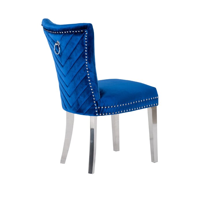 Blue velvet dining chair with silver ring and stud detail