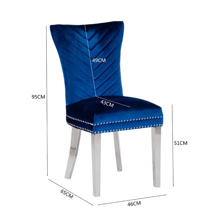 Deep blue velvet dining chair with chevron pattern back and silver studded trim