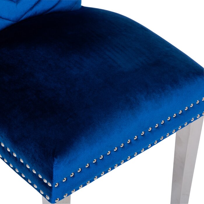 Deep blue velvet accent chair with silver nailhead trim and tufted back