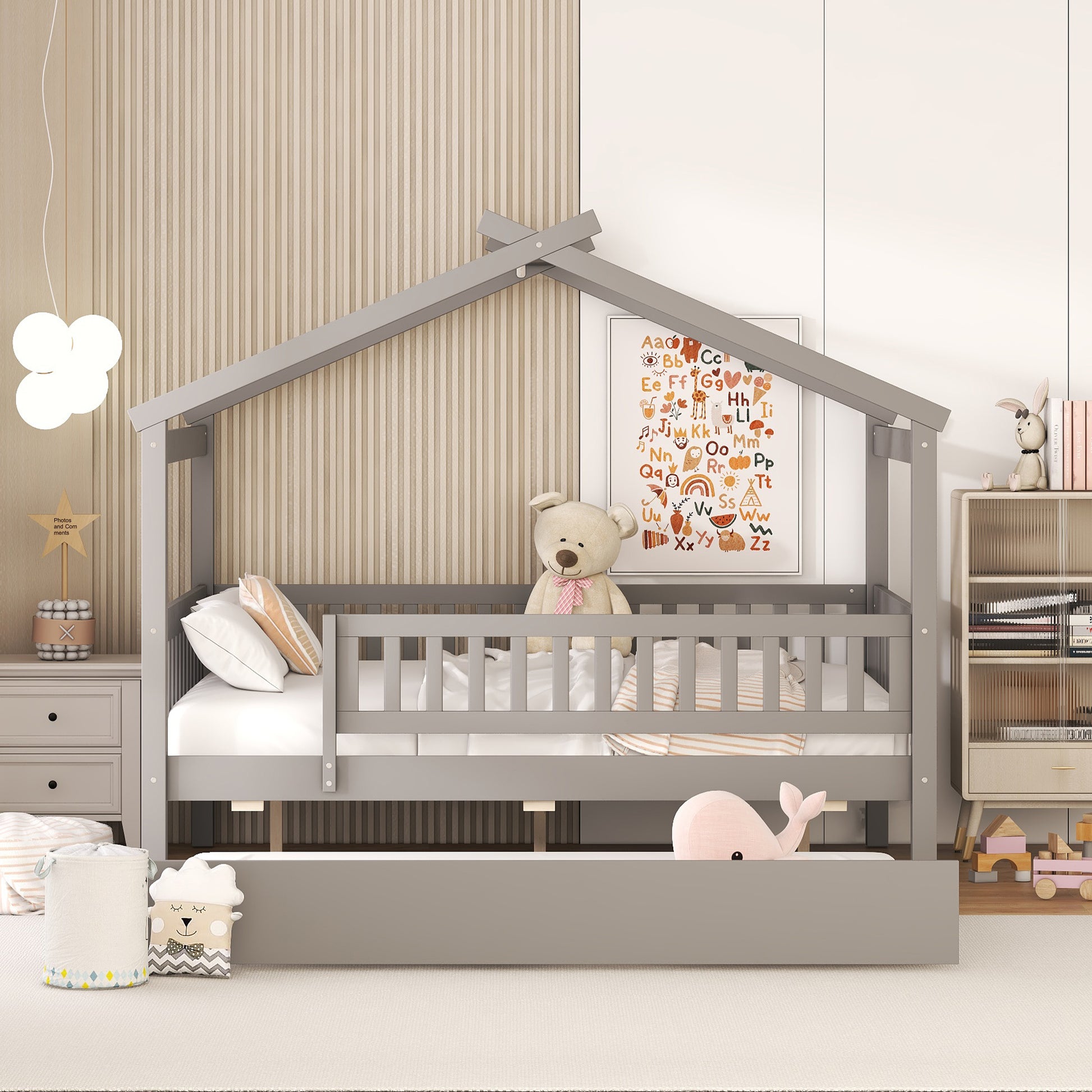 Gray wooden house bed frame for kids with safety rails and a pullout trundle bed