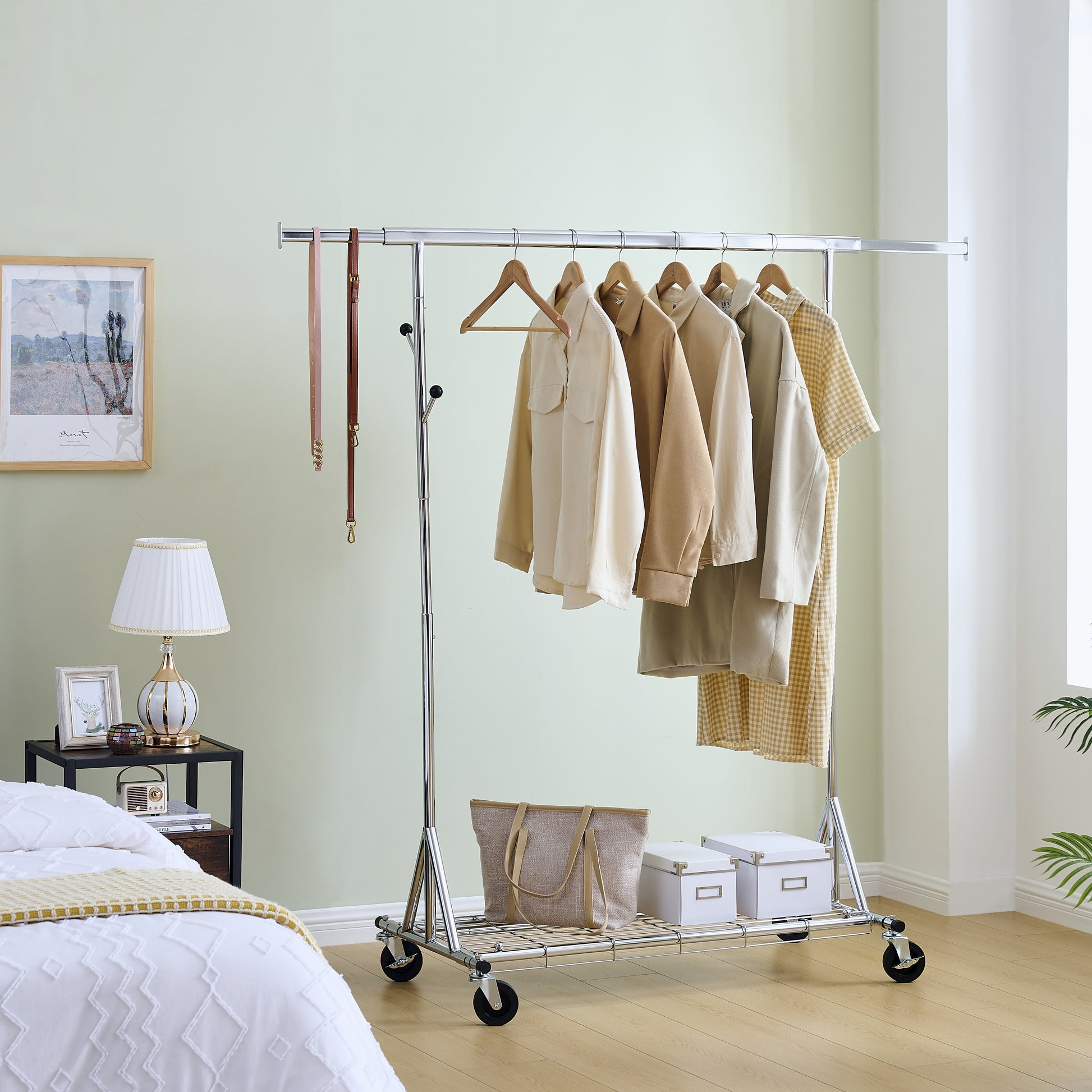 Rolling garment rack with beige shirts and storage boxes