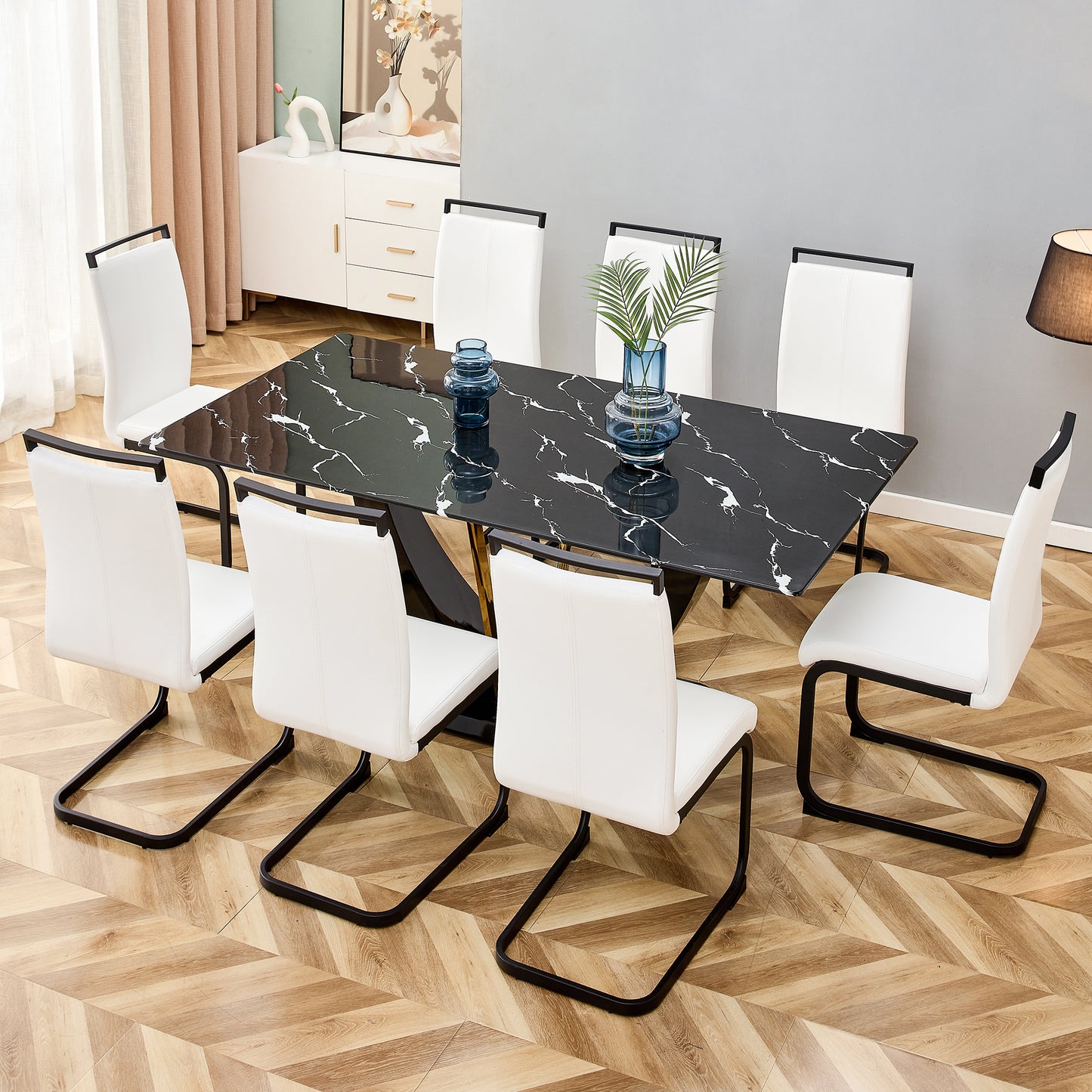Black marble dining table with  white leather chairs