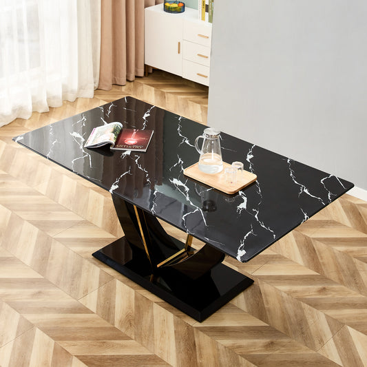 Modern black marble dining table with gold accent base