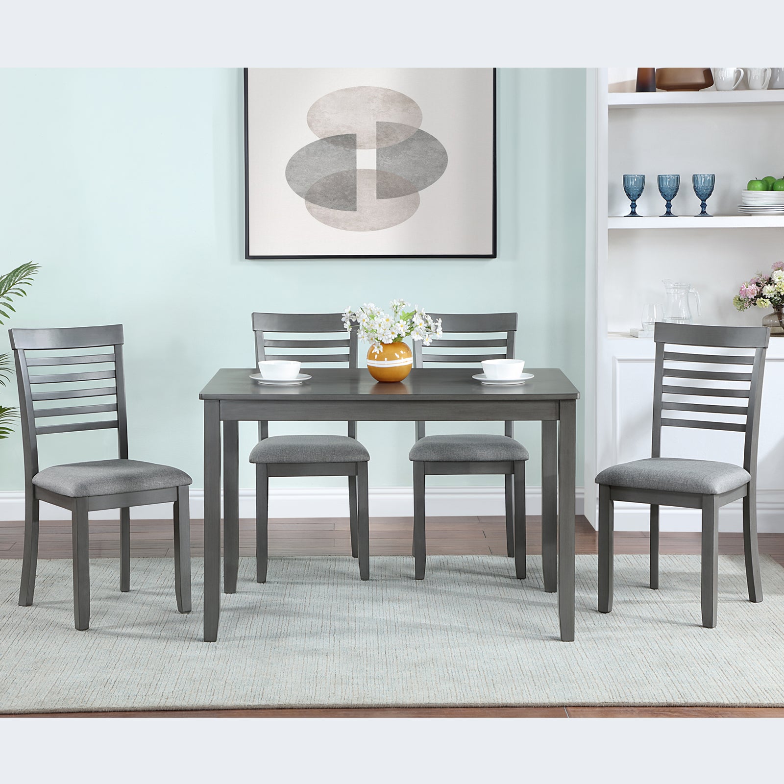 Gray wooden dining table set with upholstered chairs
