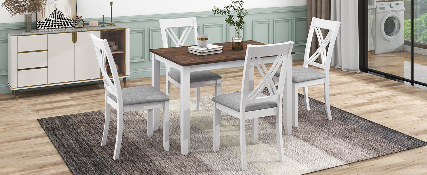 White wooden dining table with four grey upholstered chairs