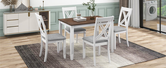 White wooden dining table with four grey upholstered chairs