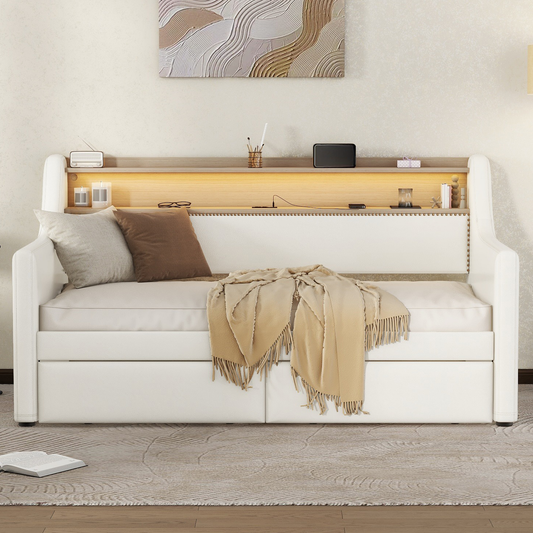 White upholstered daybed with builtin shelving and dual storage drawers