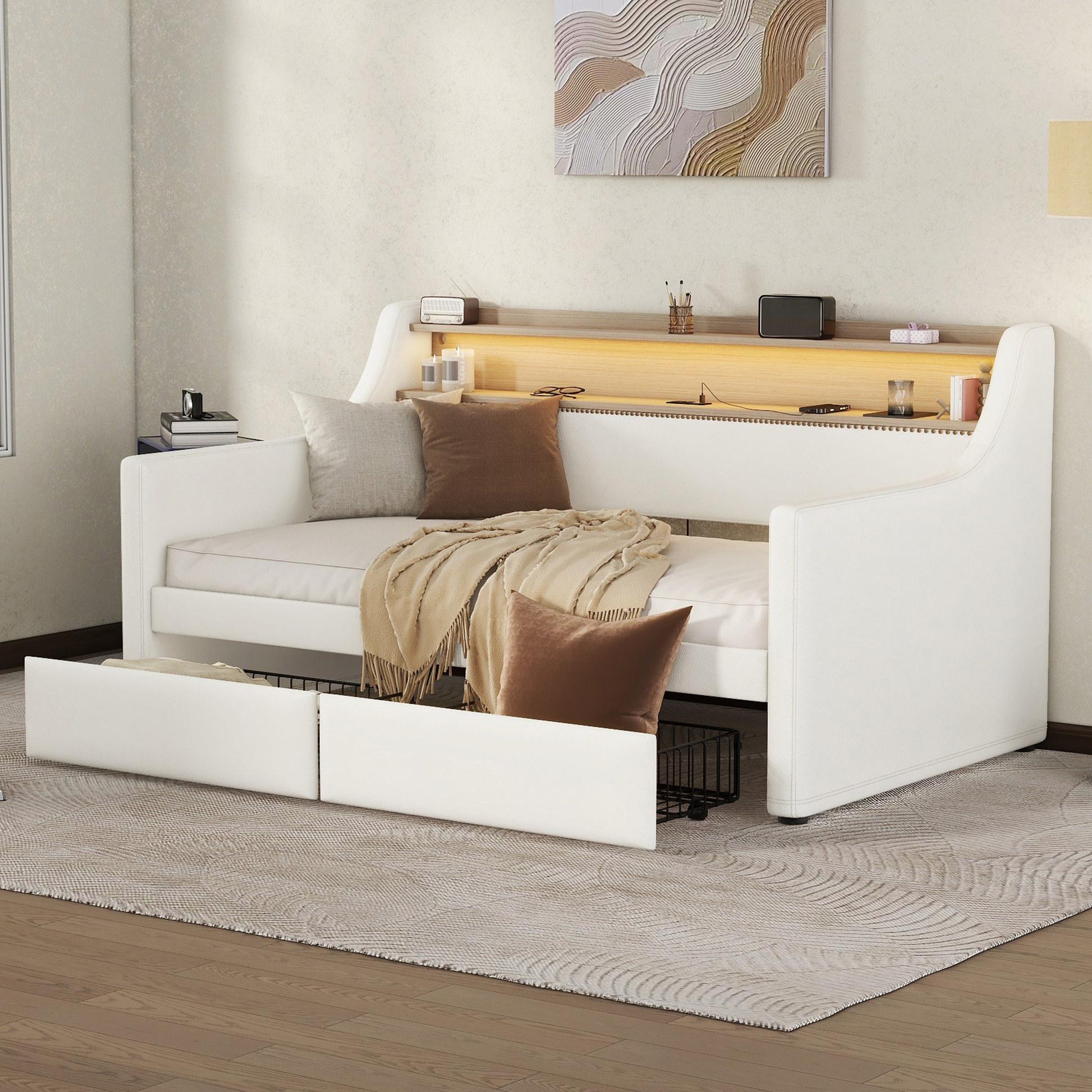 White leather daybed with integrated storage drawers and builtin headboard shelf