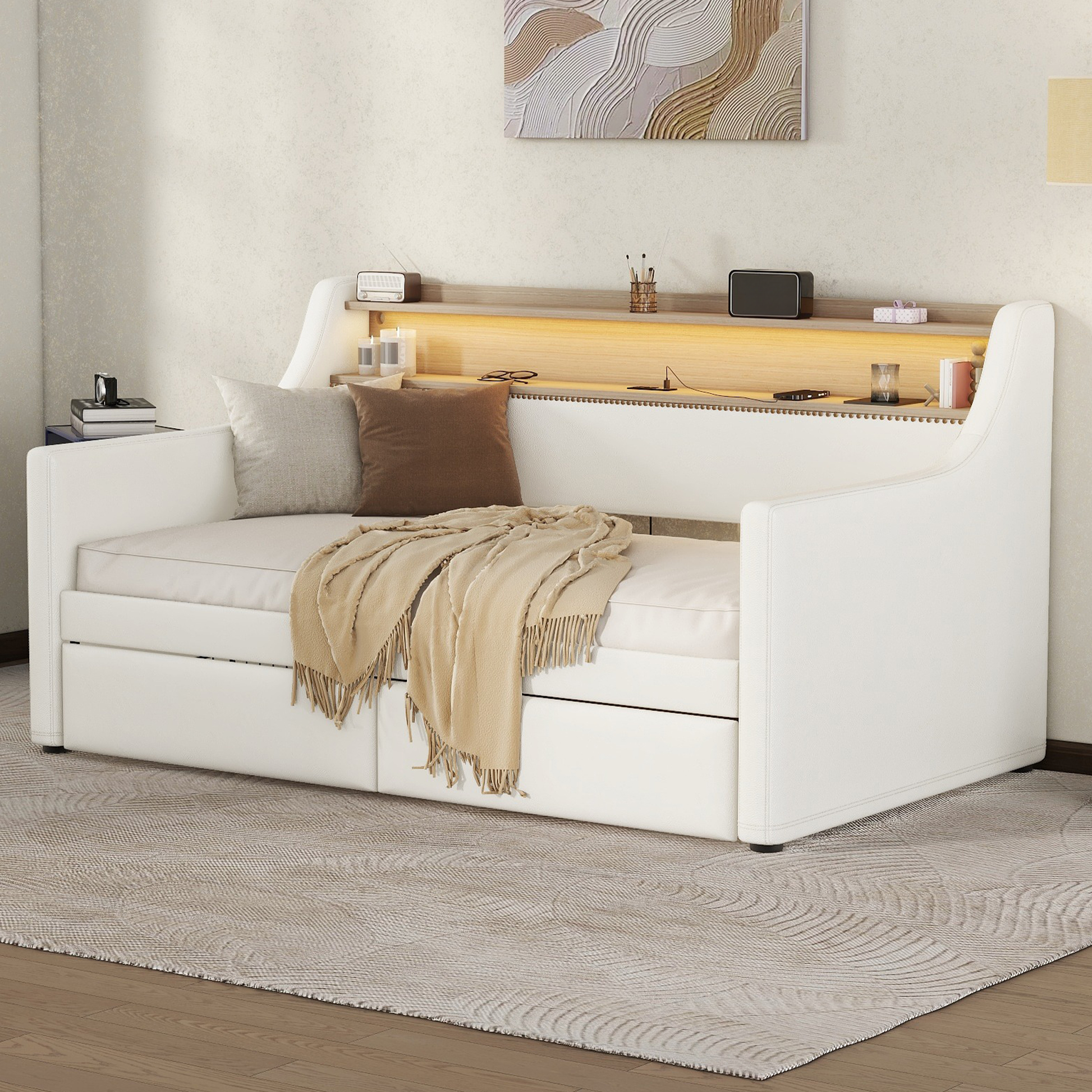 White faux leather daybed with builtin shelves and storage drawers