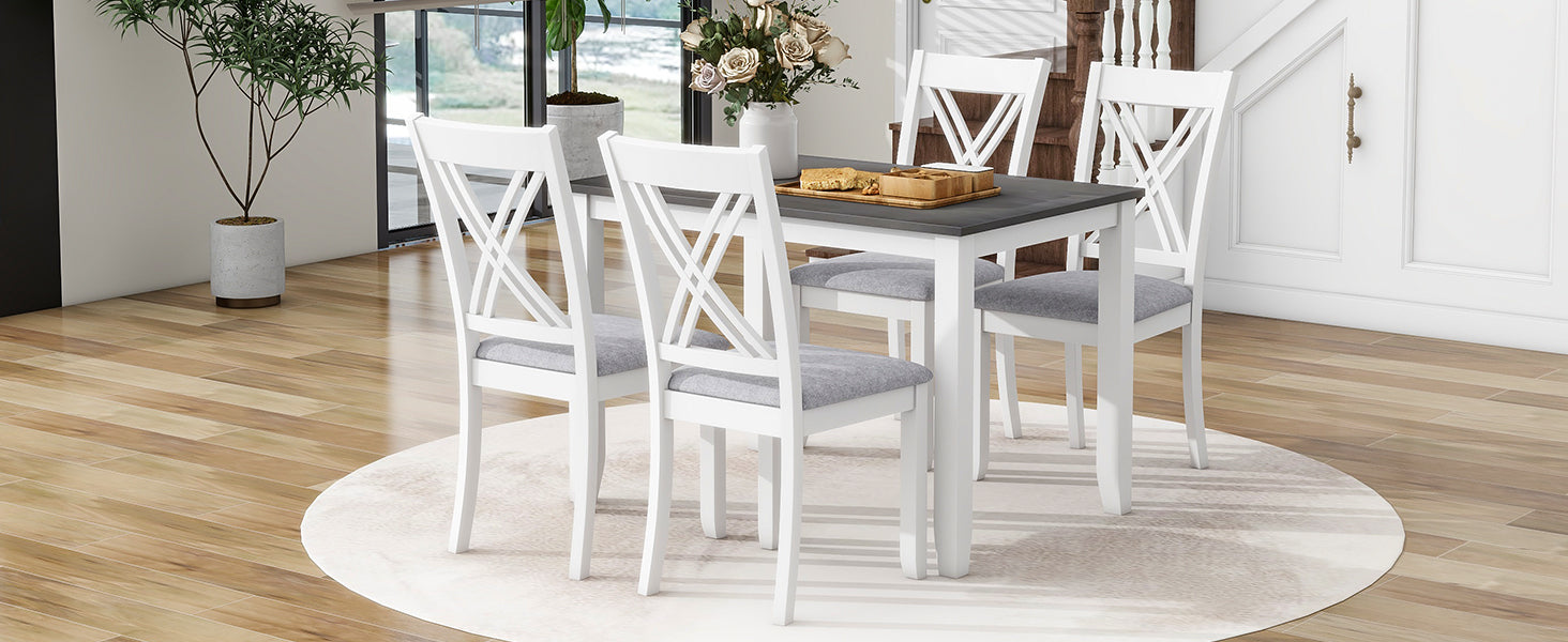 White Xback dining chairs with gray upholstered seats surround a dark gray table