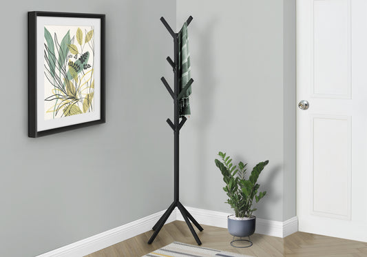 Black metal coat rack with hanging striped scarf