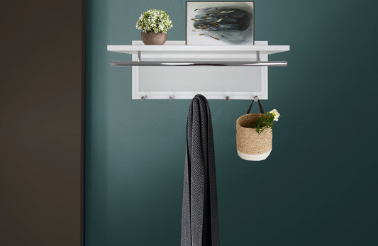 White modern wall shelf with hooks and a metal rod