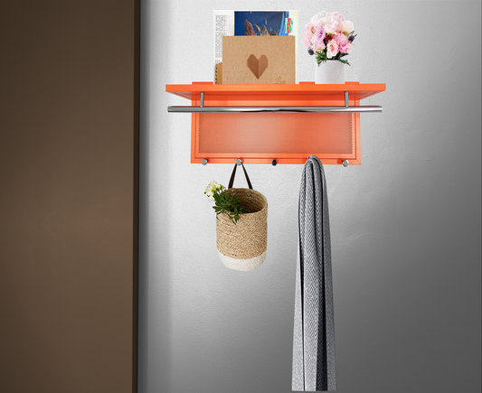 Orange wall mounted shelf with chrome rail and perforated front