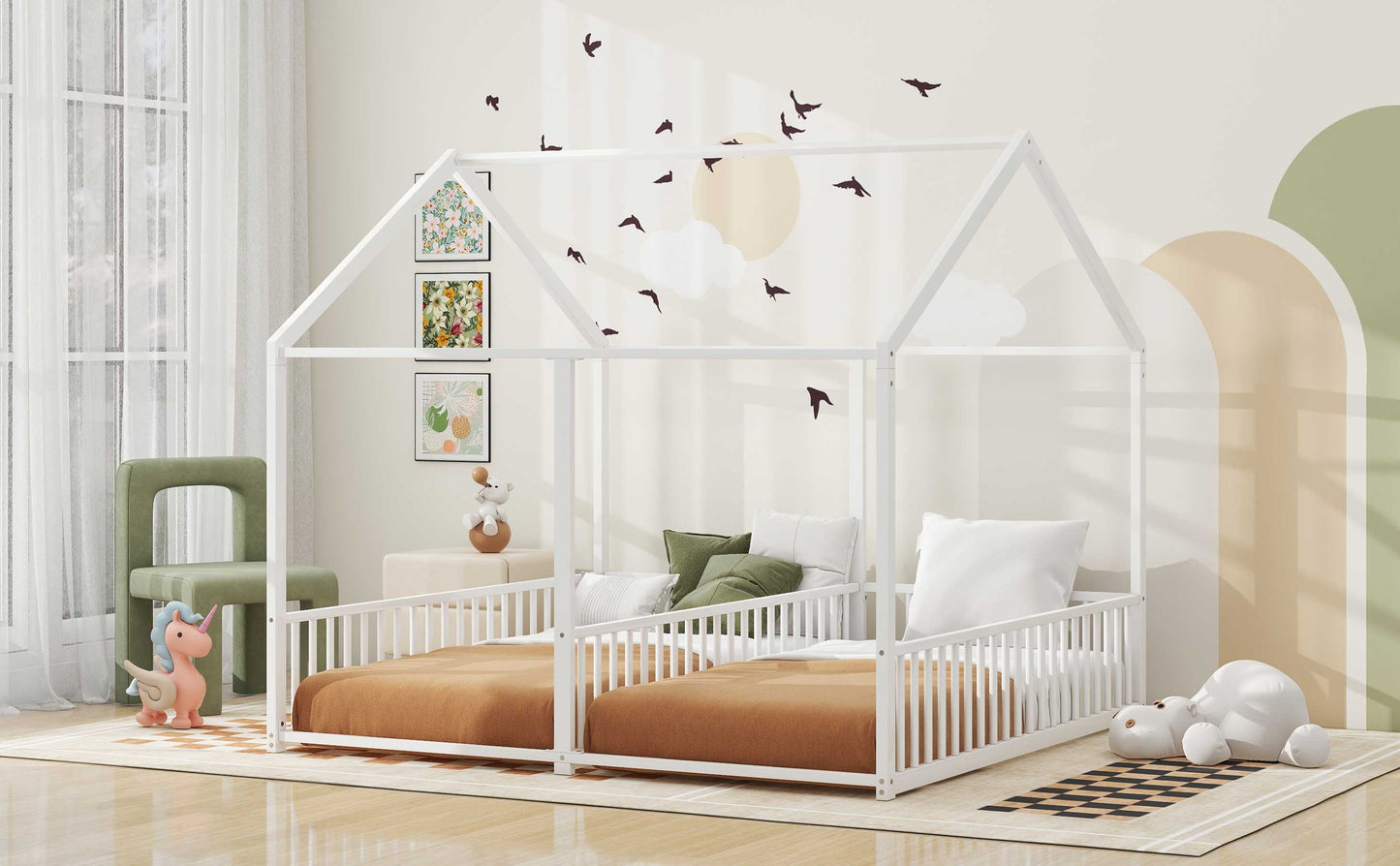 White wooden twin house bed with picket railings and tan bedding