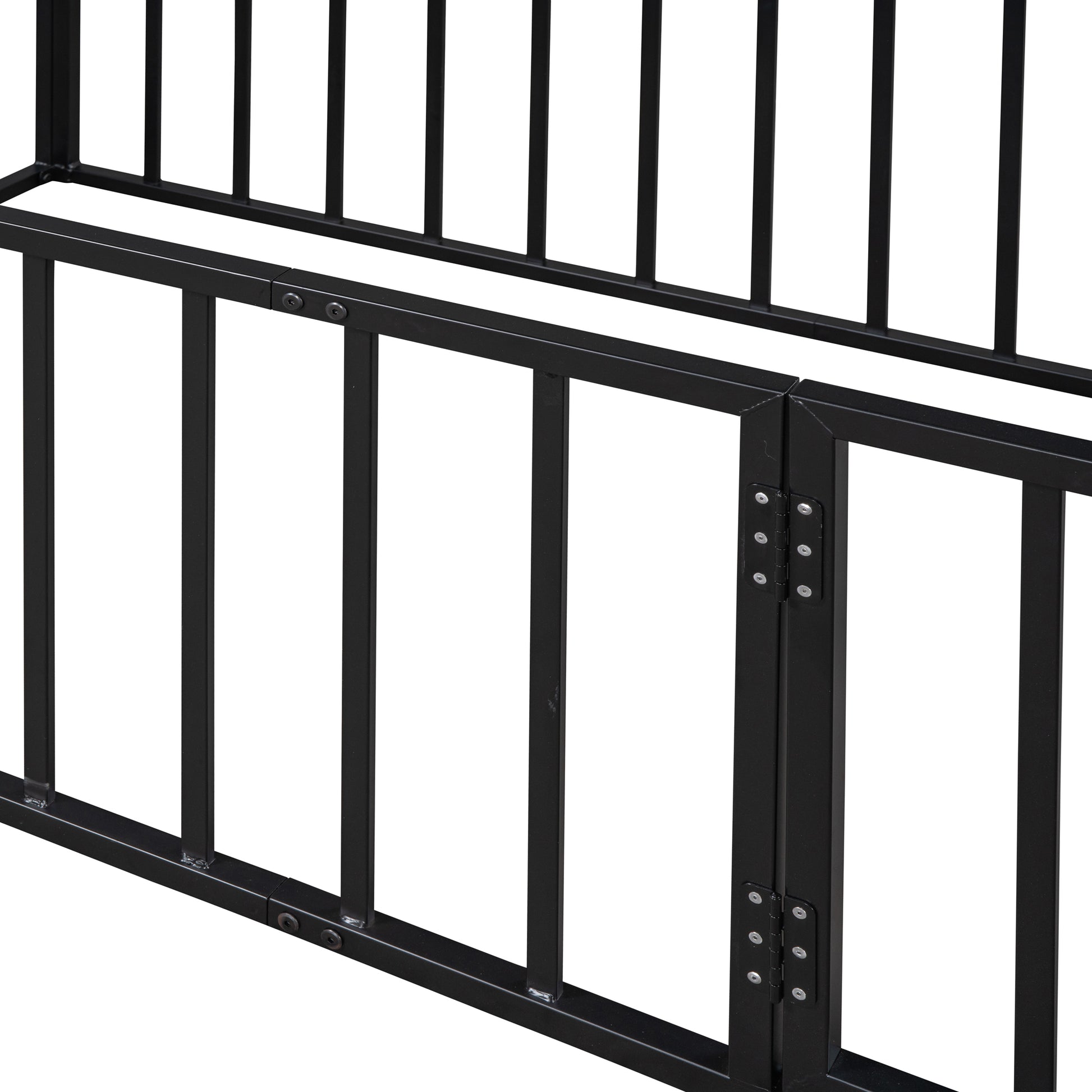 Closeup of black metal bed frame with vertical slats and horizontal support beam