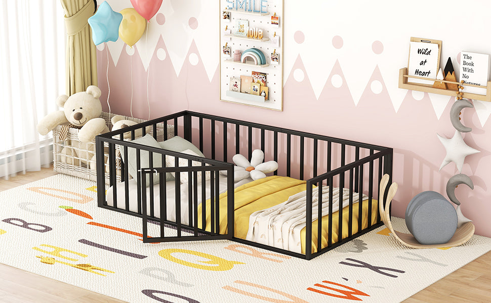 Black metal toddler bed with open gate and yellow bedding