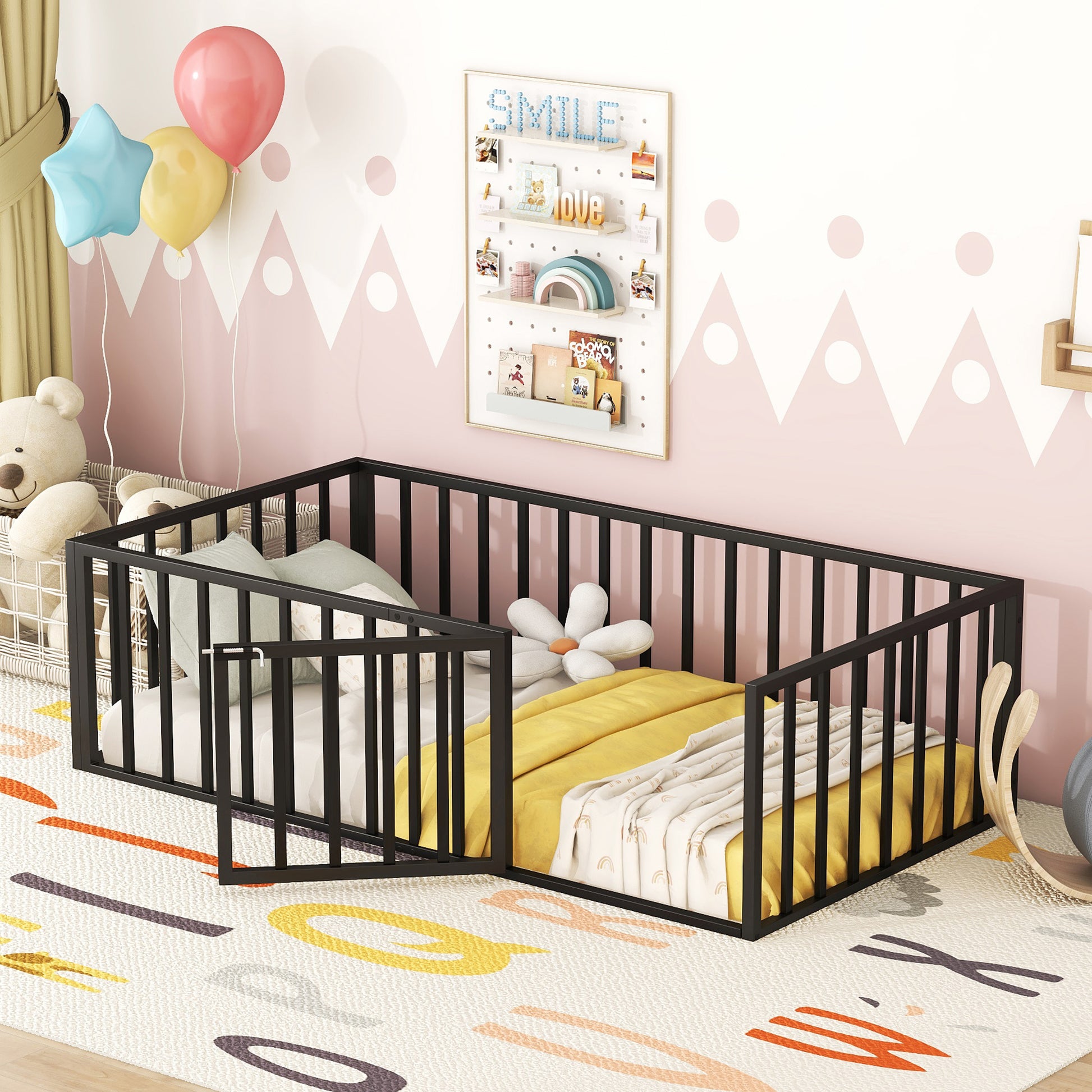 Black metal toddler bed with safety rails and yellow bedding