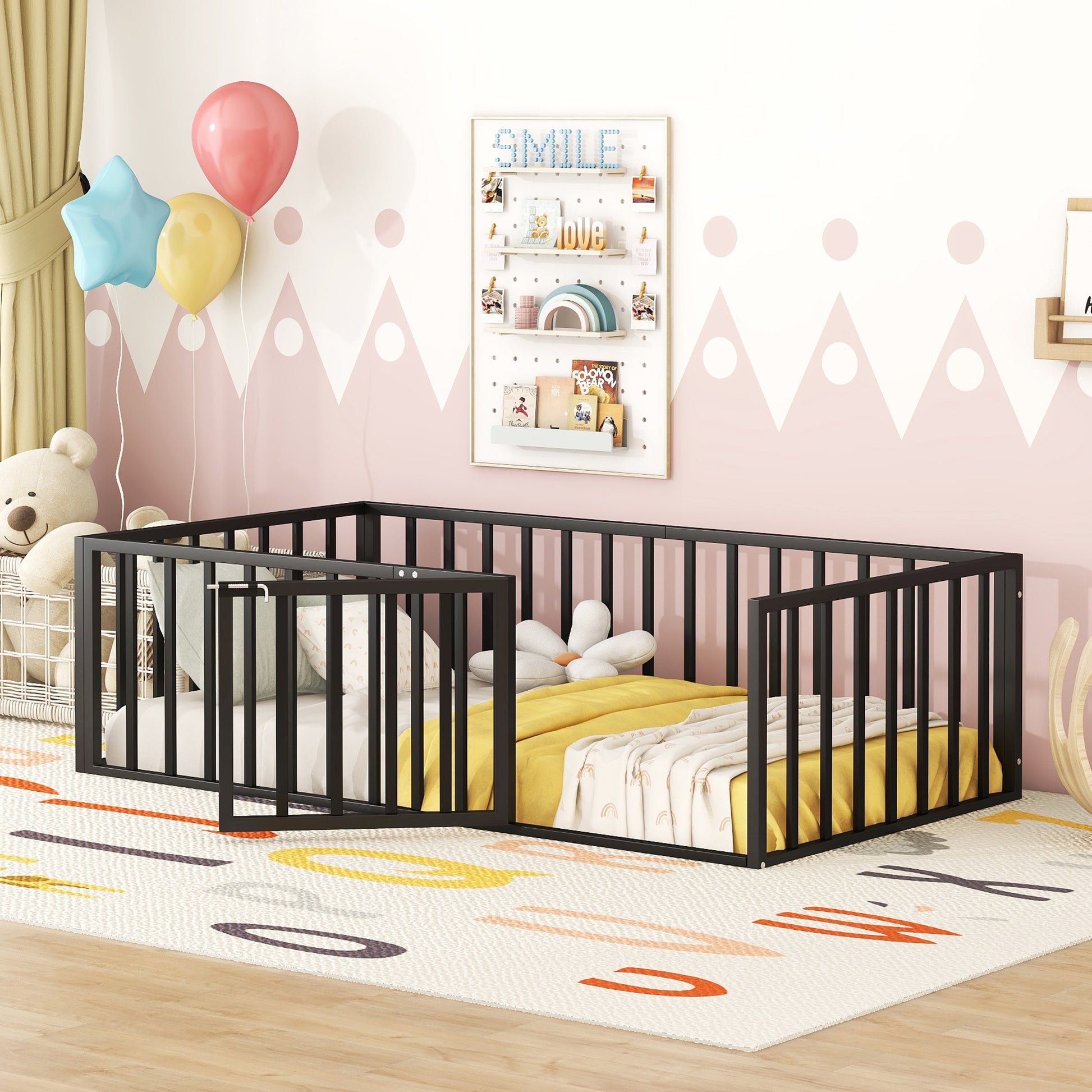 Black metal toddler bed frame with guardrails