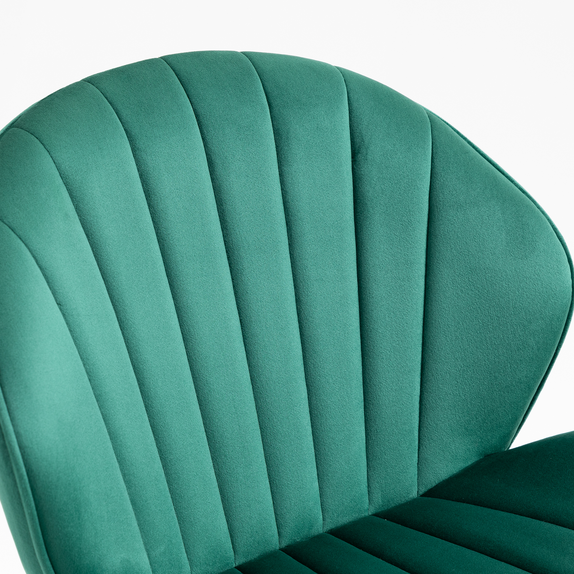 Emerald green velvet chair with channel tufting