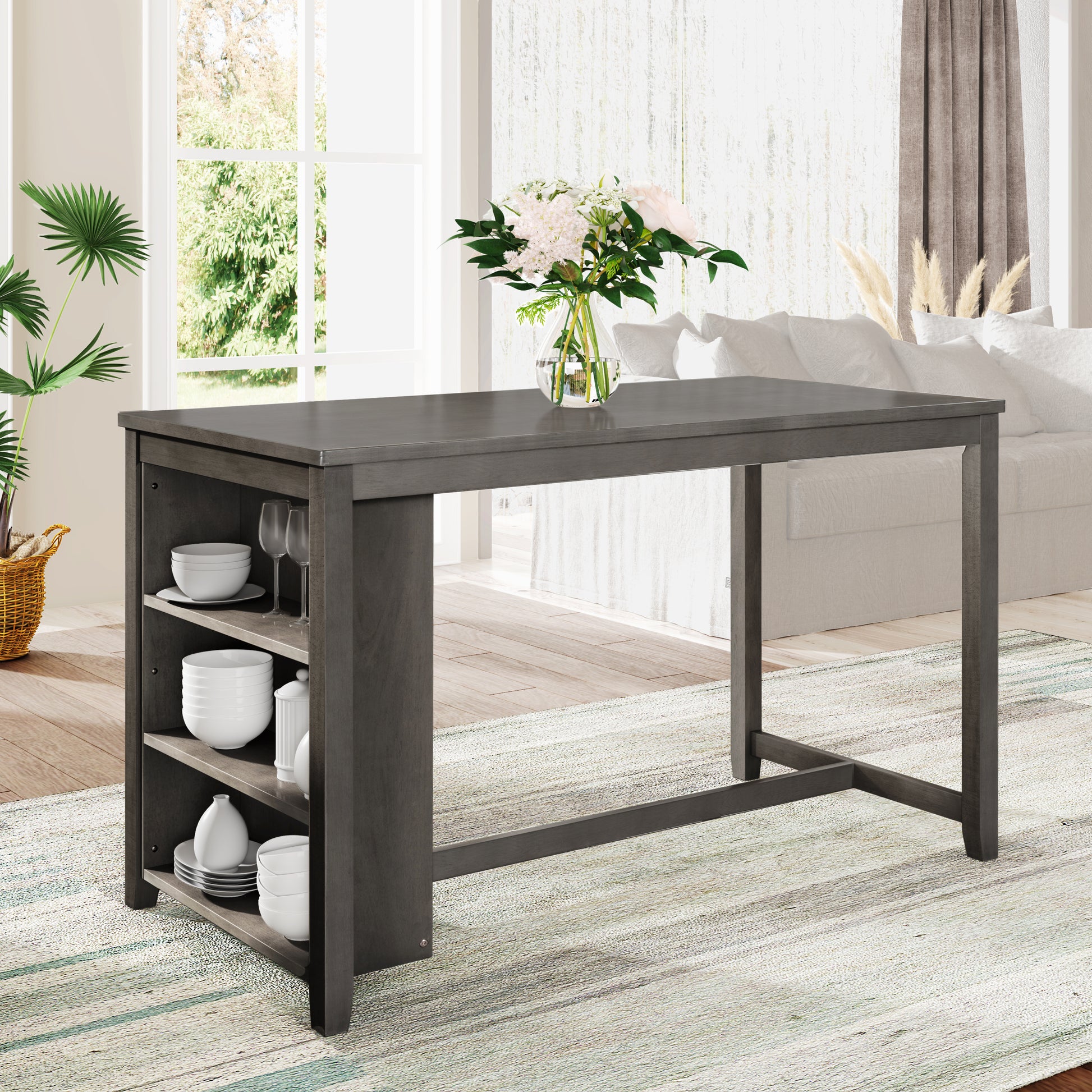 Gray wood high top table with open shelving and kitchenware