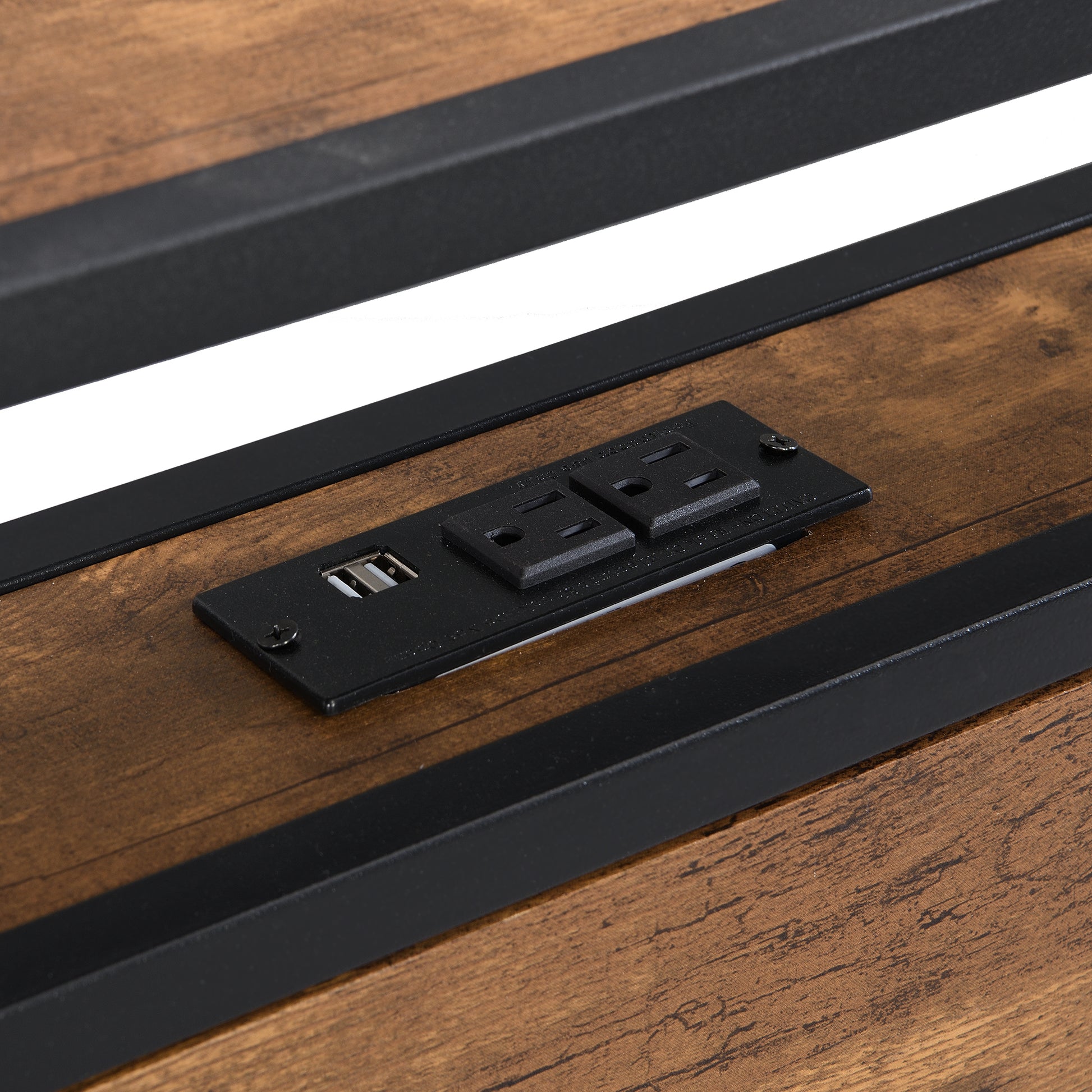 Rustic wood grain charging station with  AC outlets and  USB ports integrated into furniture