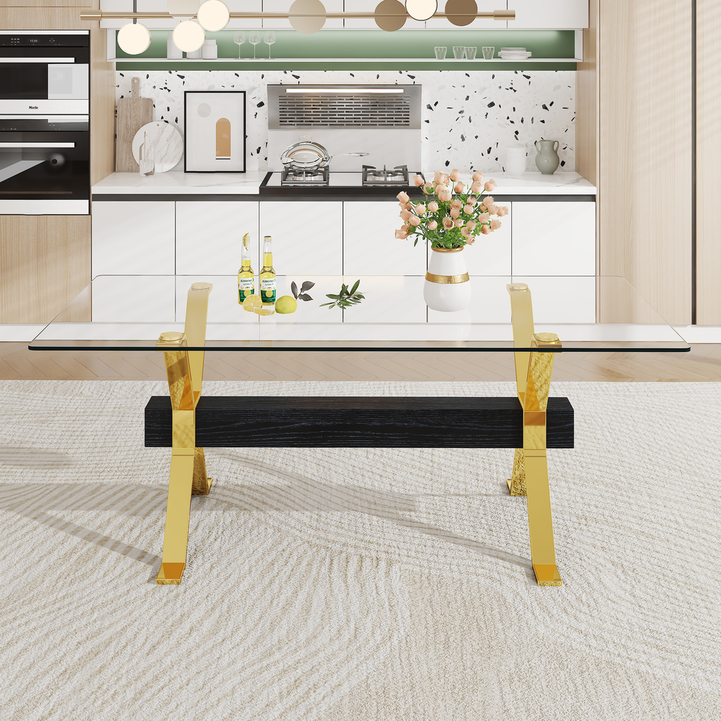 Modern glass dining table with gold cross legs and black wood accent