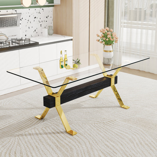 Elegant glass top dining table with Xshaped gold legs and dark wood base
