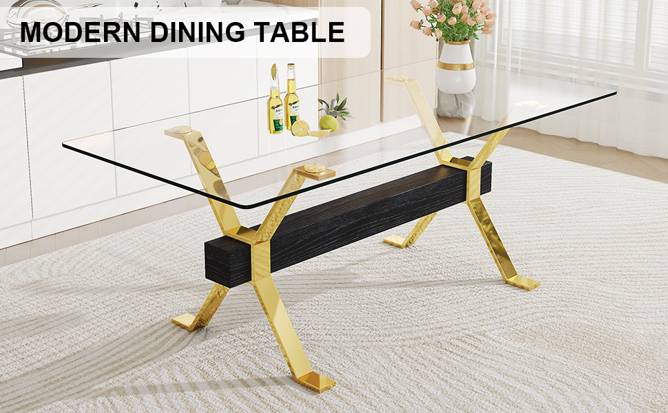Glass top dining table with gold Xframe legs and dark wood center