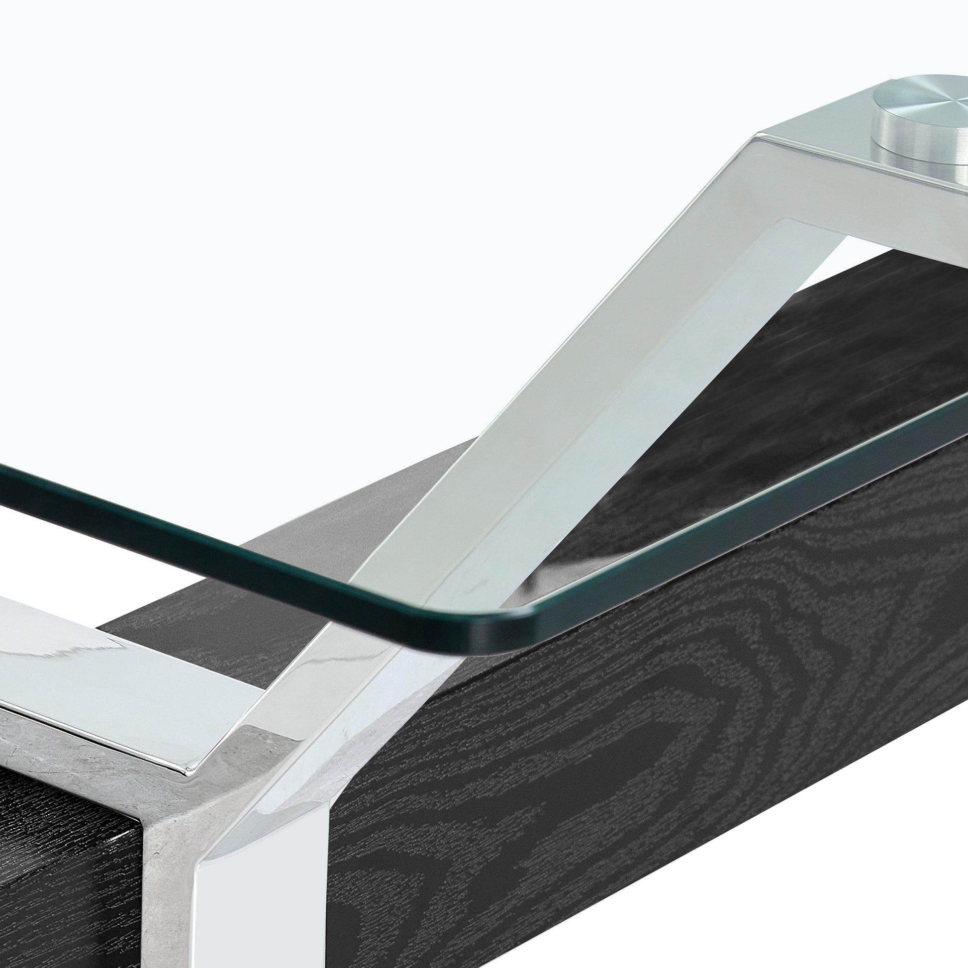 Modern black wood coffee table with polished chrome legs and glass top