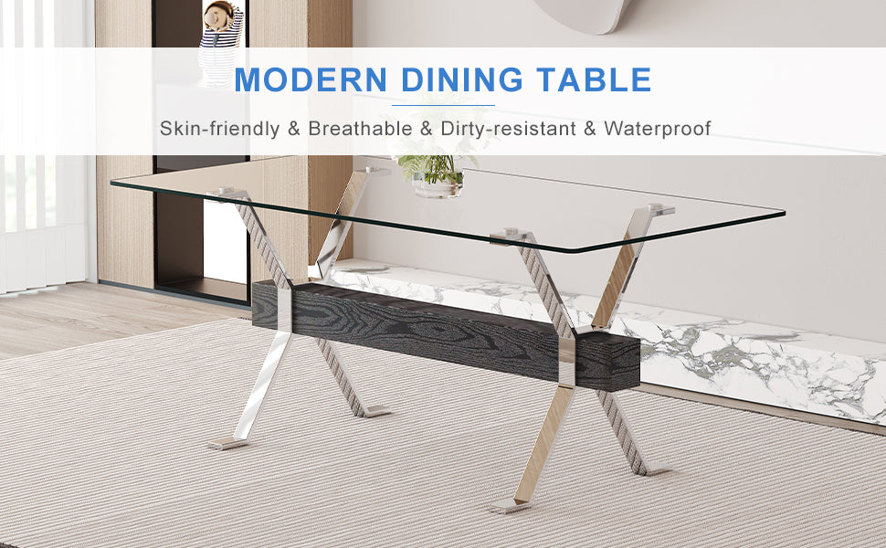 Glass top dining table with Xshaped chrome legs and dark wood accent