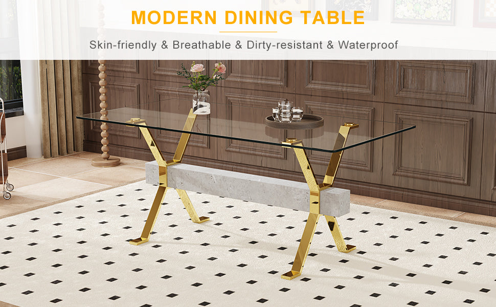 Glass dining table with gold crisscross legs and a concrete base