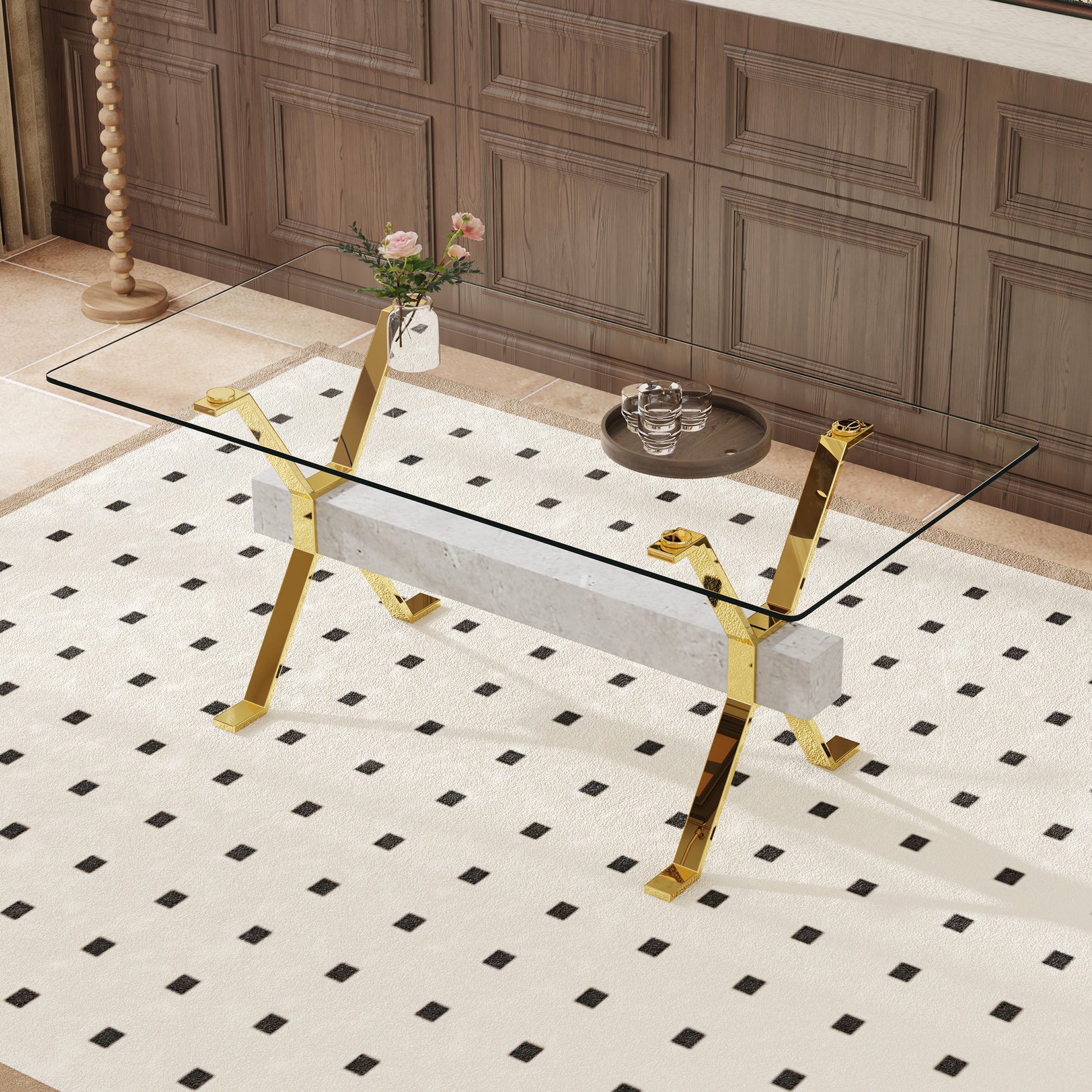 Modern glass coffee table with polished gold legs and marble base
