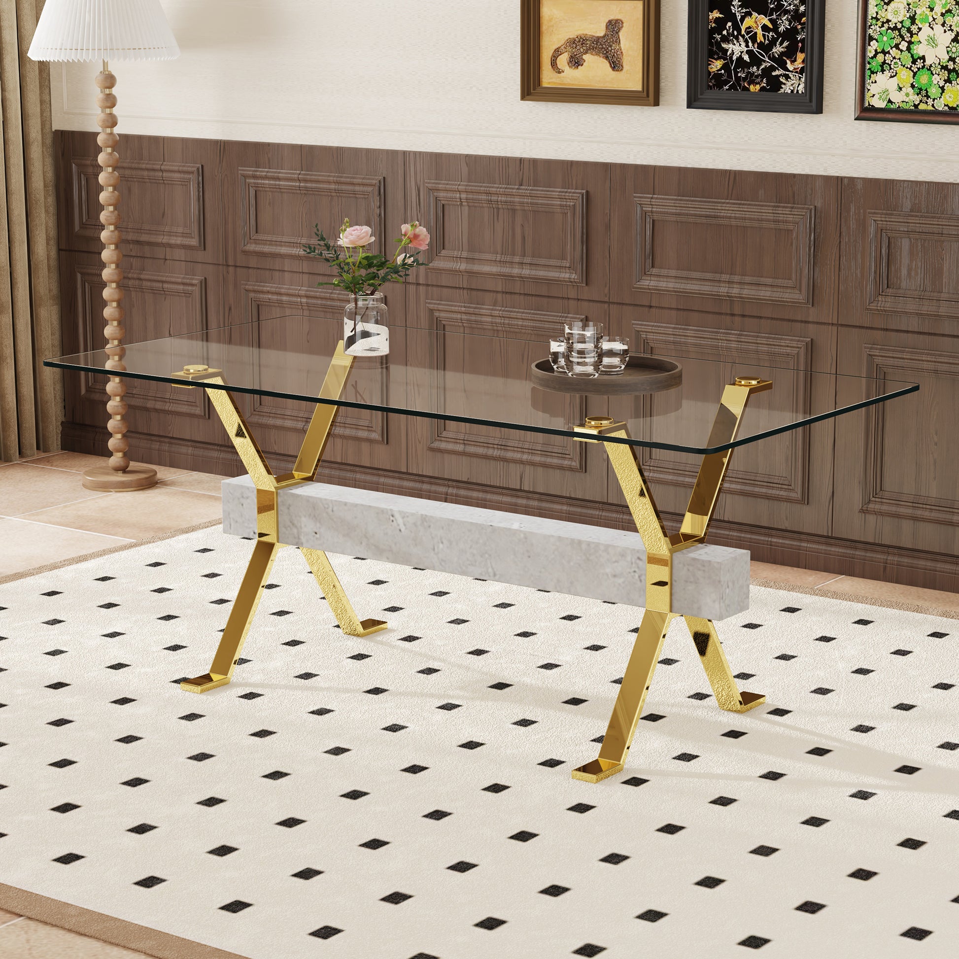 Glass top coffee table with gold Xframe legs and concrete base