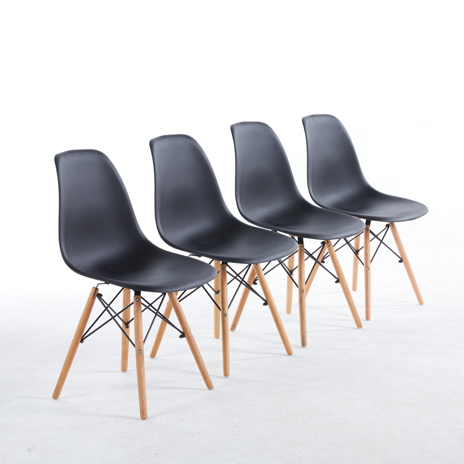 Set of four black dining chairs with wood legs