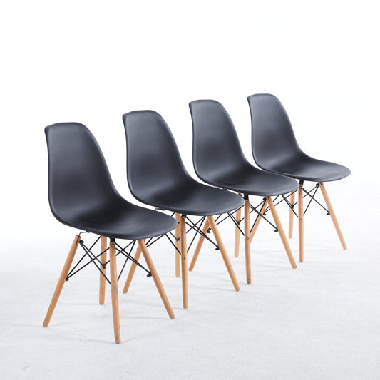 Set of four black dining chairs with wood legs