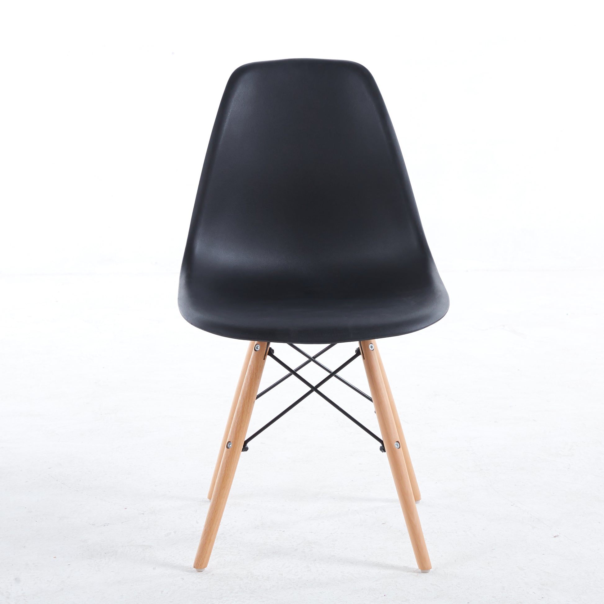 Black molded dining chair with natural wood legs