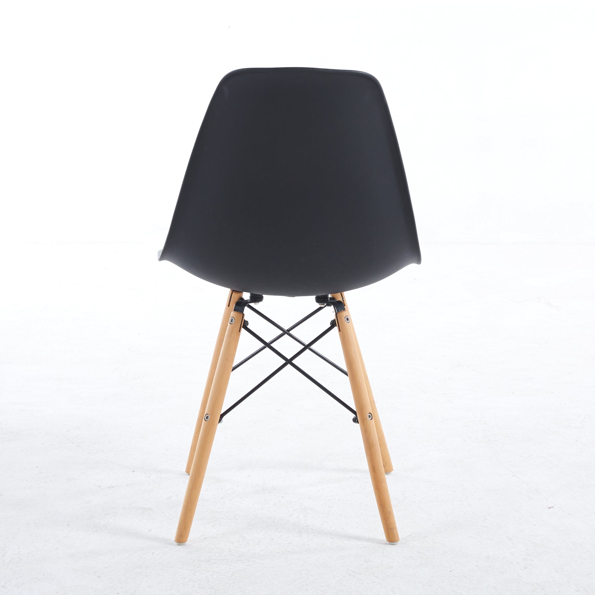 Black plastic modern dining chair with beech wood legs