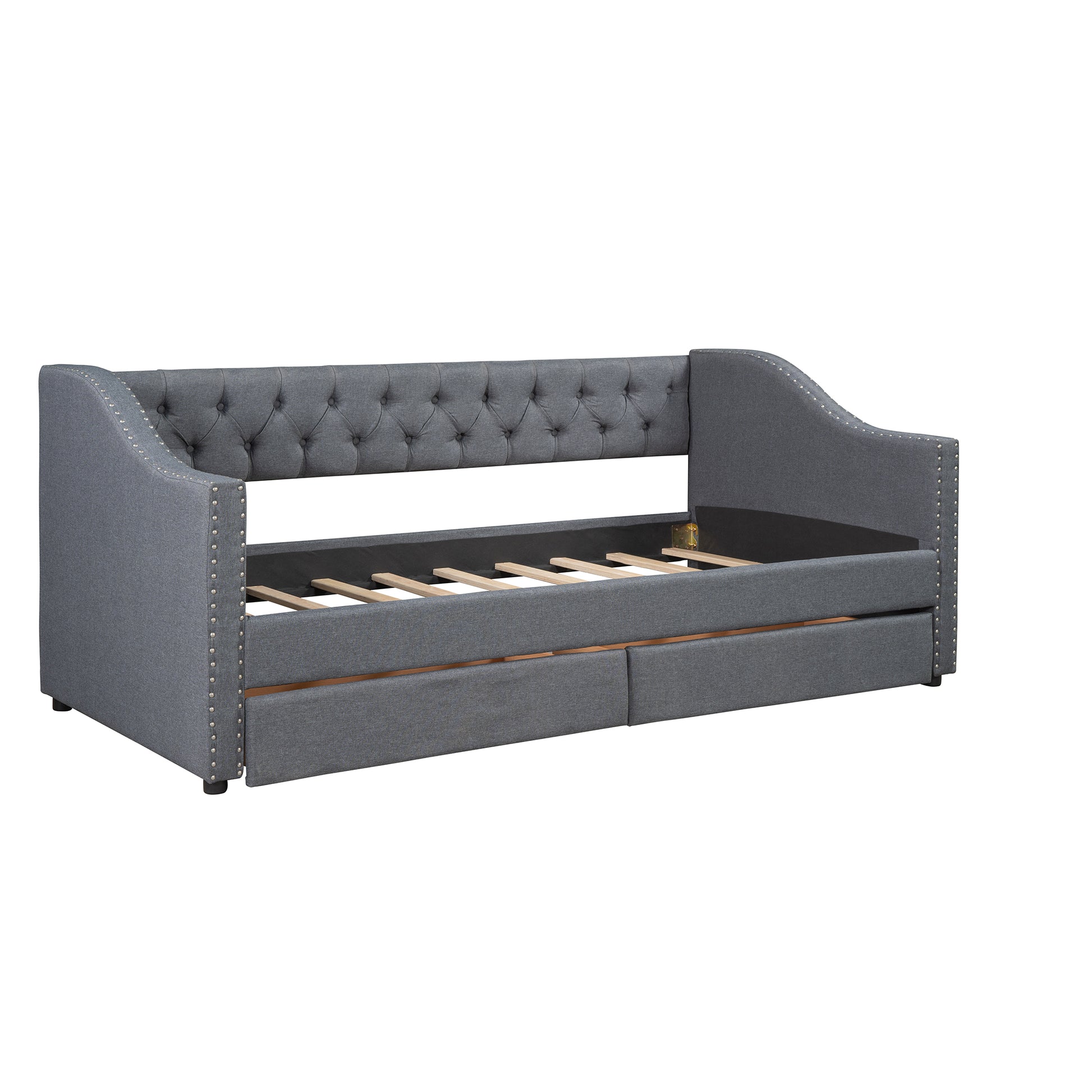Gray tufted daybed with nailhead trim and pullout trundle
