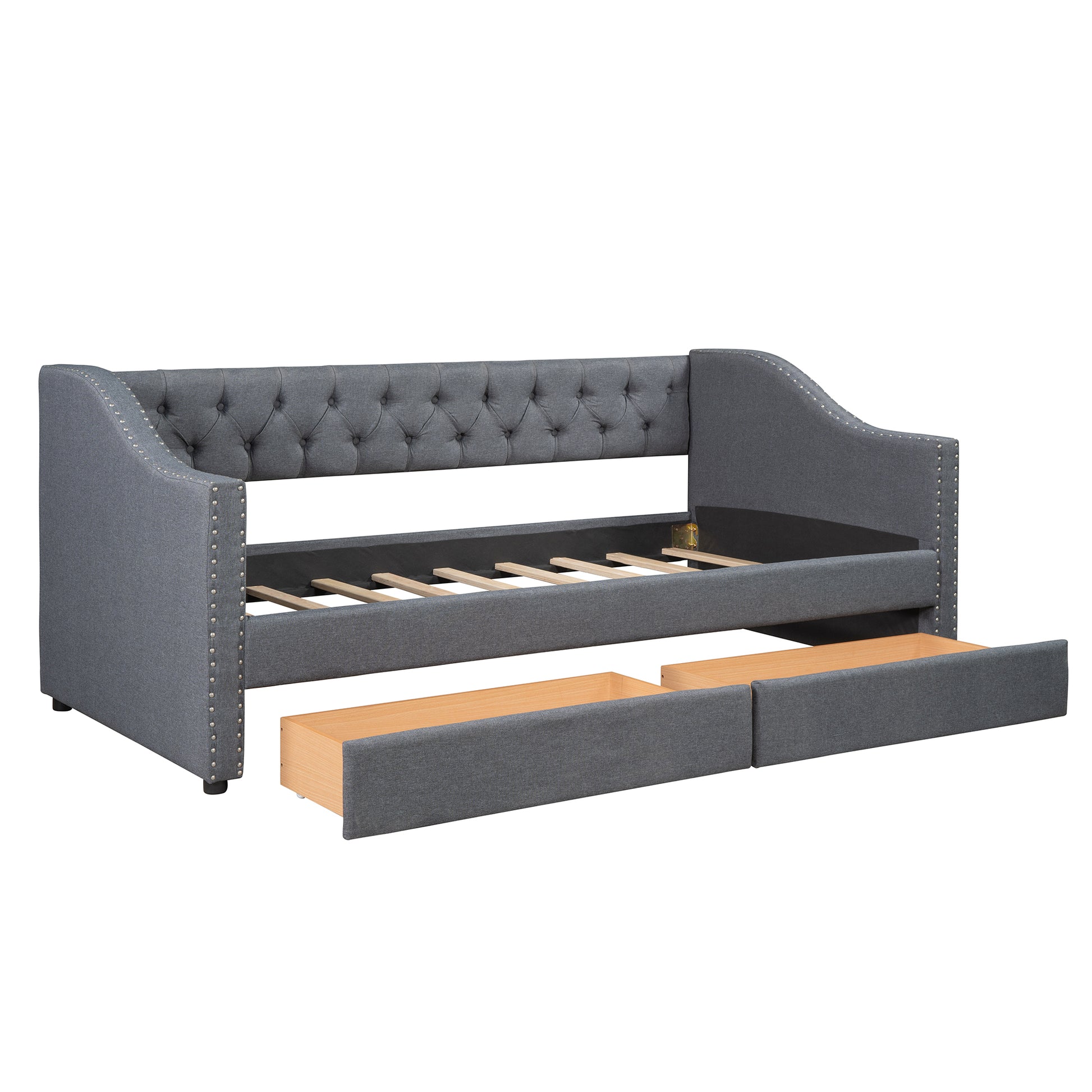 Gray upholstered daybed with tufted back and two pullout drawers for storage