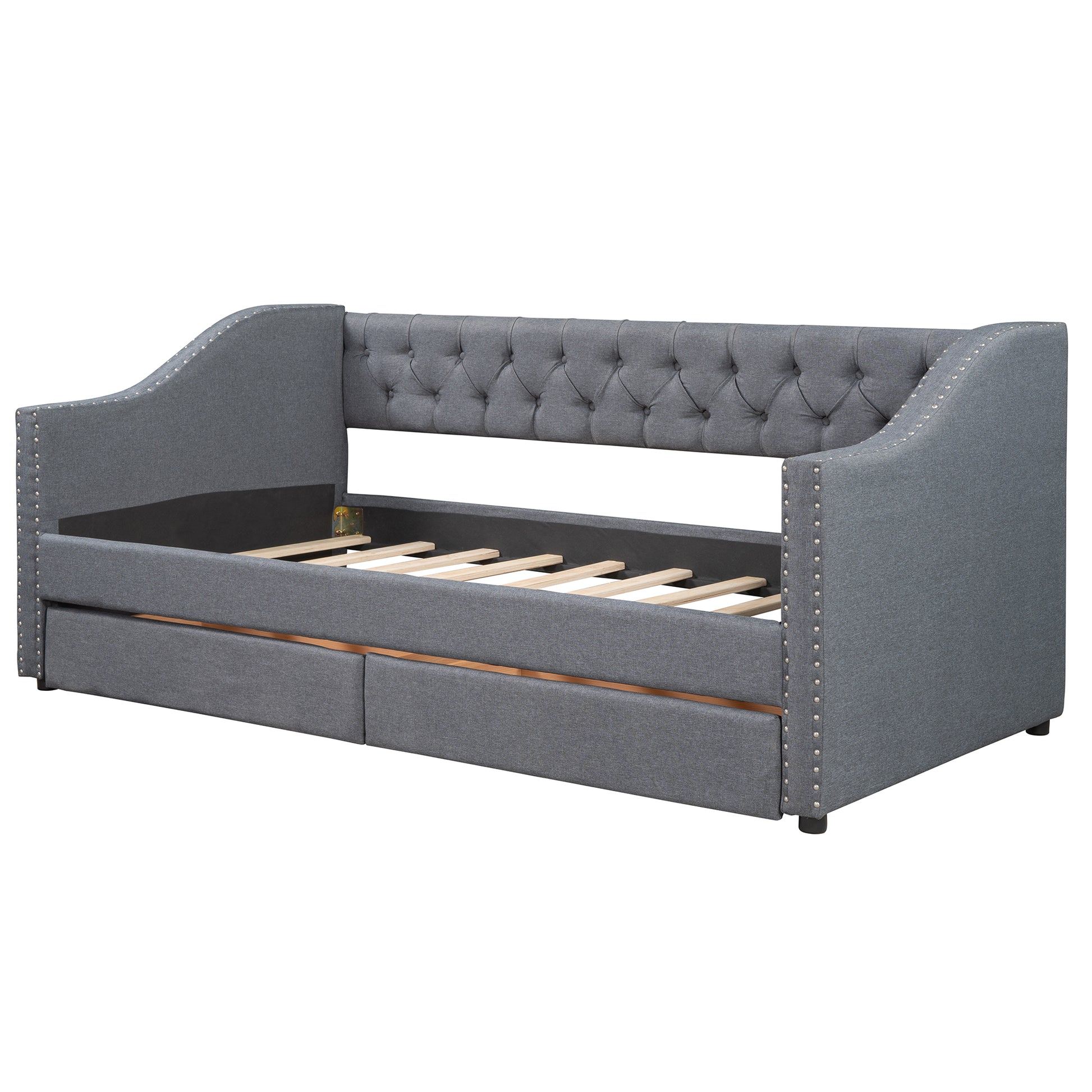 Gray upholstered daybed with tufted back and nailhead trim