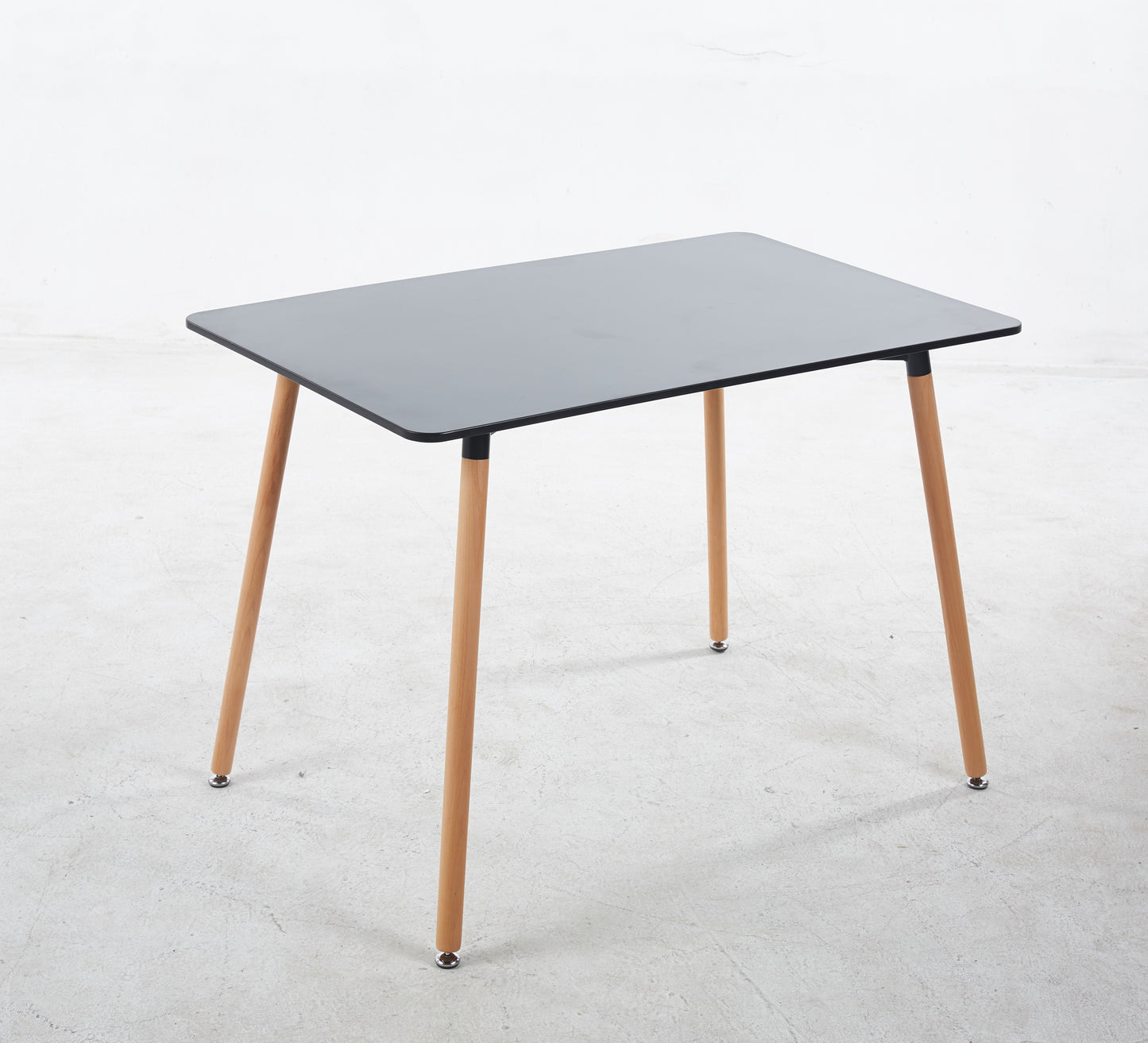 Modern gray rectangular dining table with natural wood legs perfect for small spaces