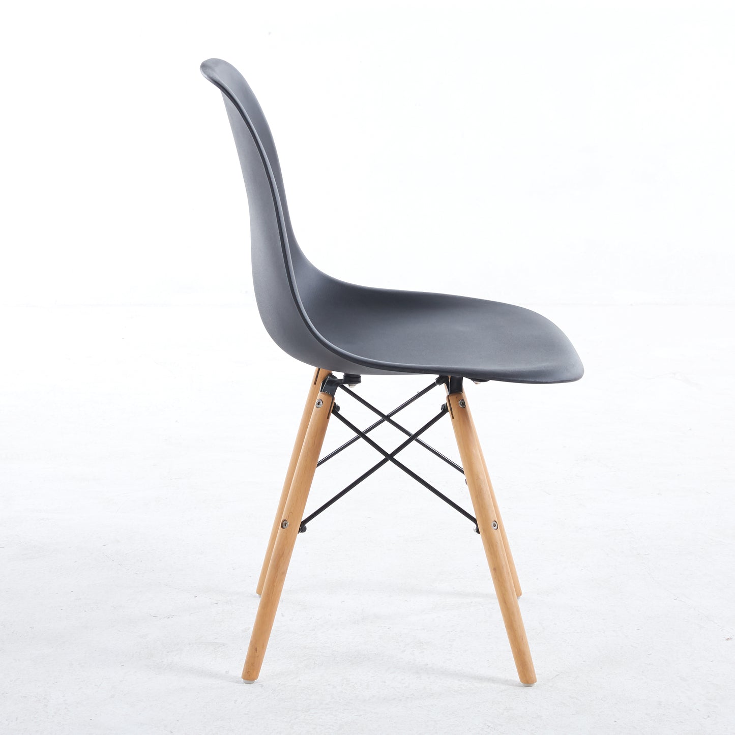Black molded plastic chair with natural wood legs and cross brace