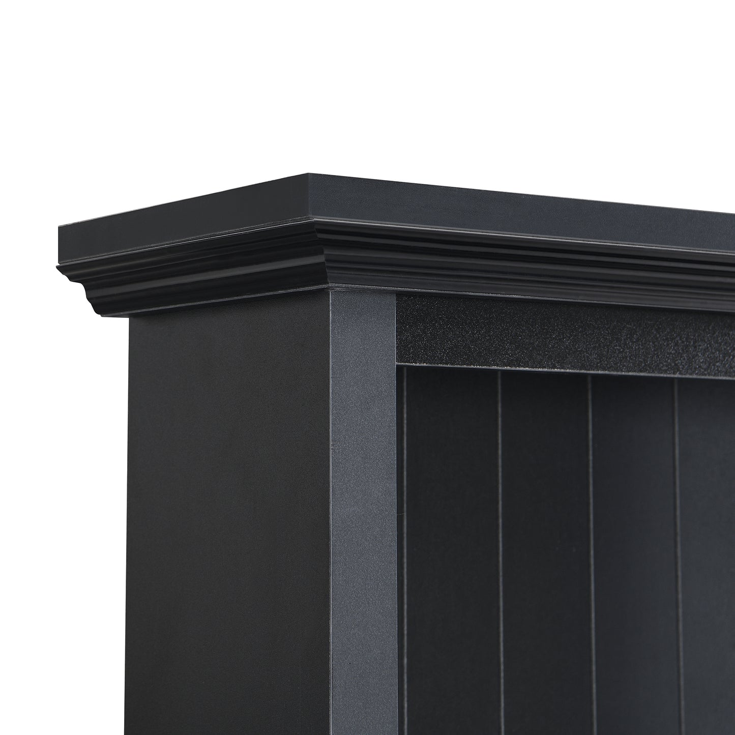 Detailed view of the ornate black cornice on a dark wood bookshelf