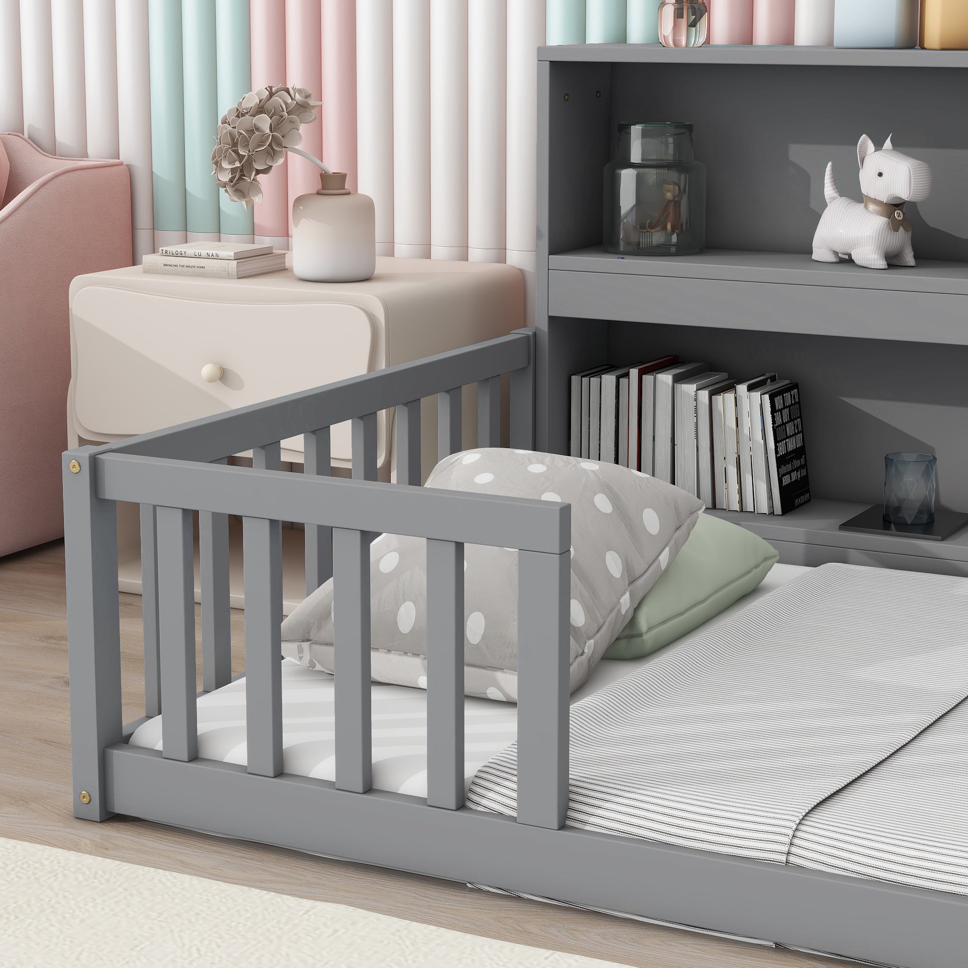 Gray toddler bed with guardrail and polka dot bedding