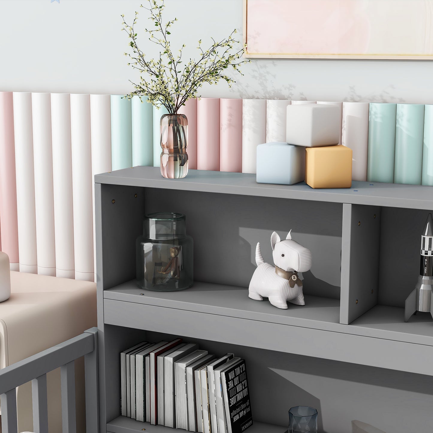 Gray modern bookshelf with decorative items like books and dog toy