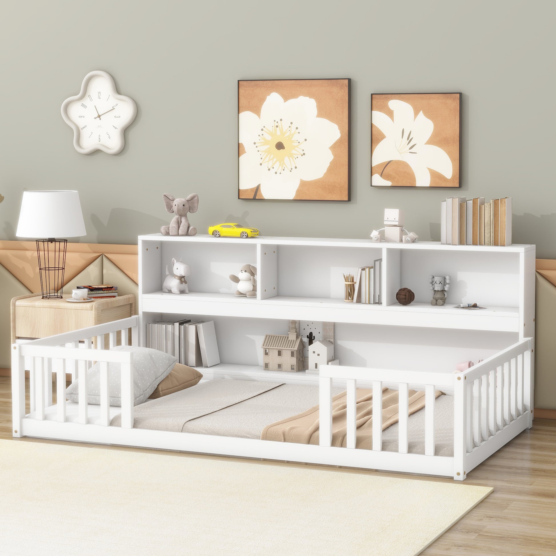 White toddler bed with safety rails and integrated bookshelf for nursery organization