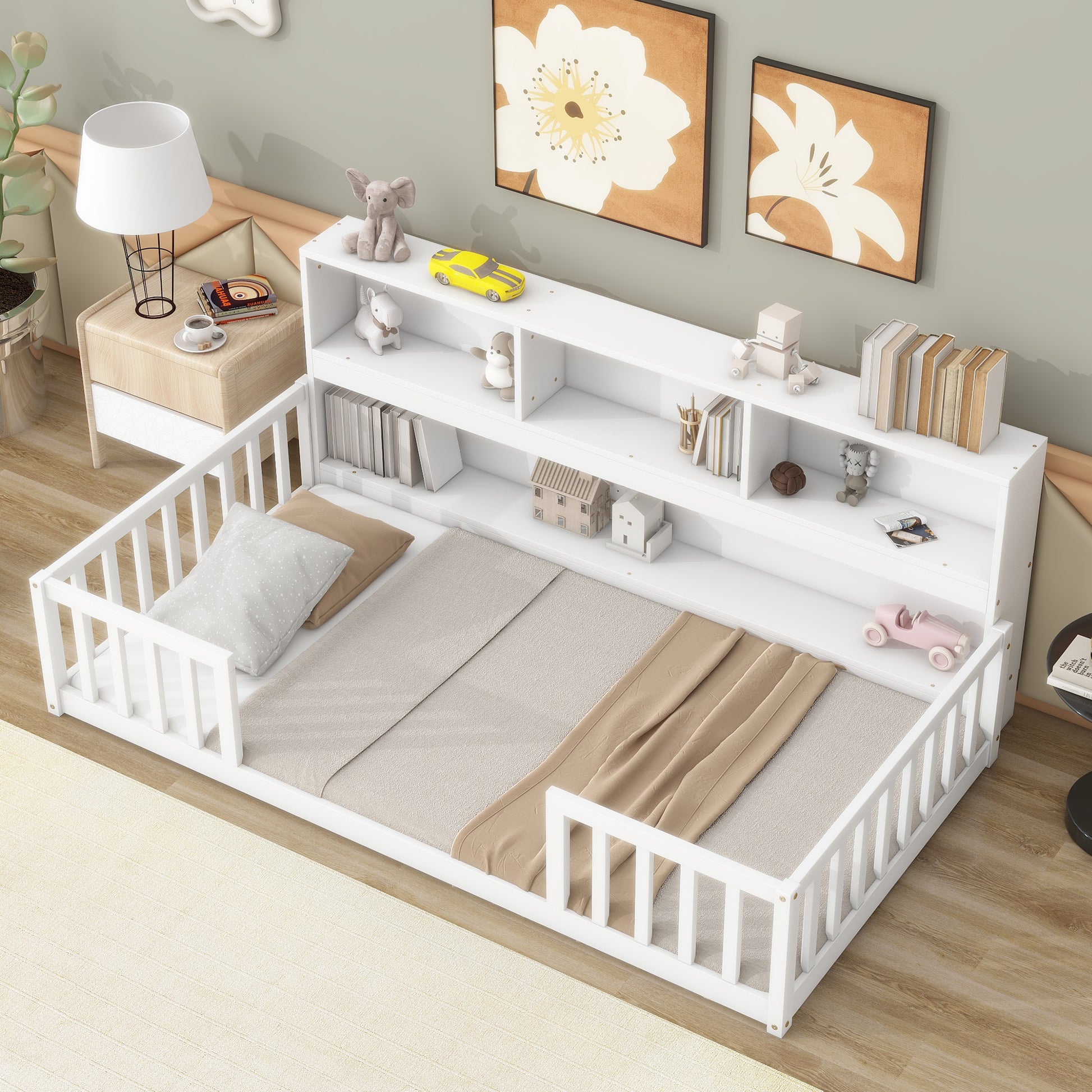 White toddler bed with integrated bookshelf and guardrails